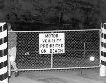 Motor vehicles prohibited on beach sign in 1985 black and white photo